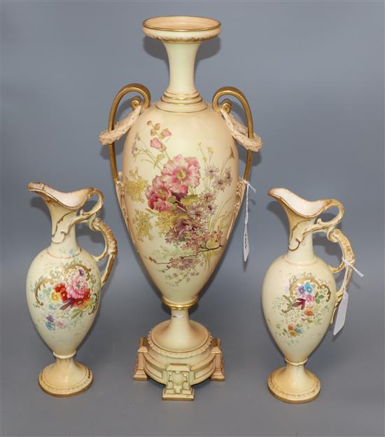 A Royal Worcester blush ivory amphora-shaped vase and a pair of similar Royal Bonn ewers, Vase H.47cm